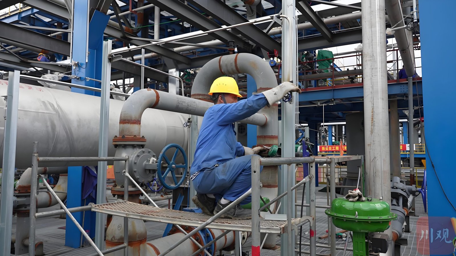 Technician inspecting RTO ductwork and heat-recovery process equipment