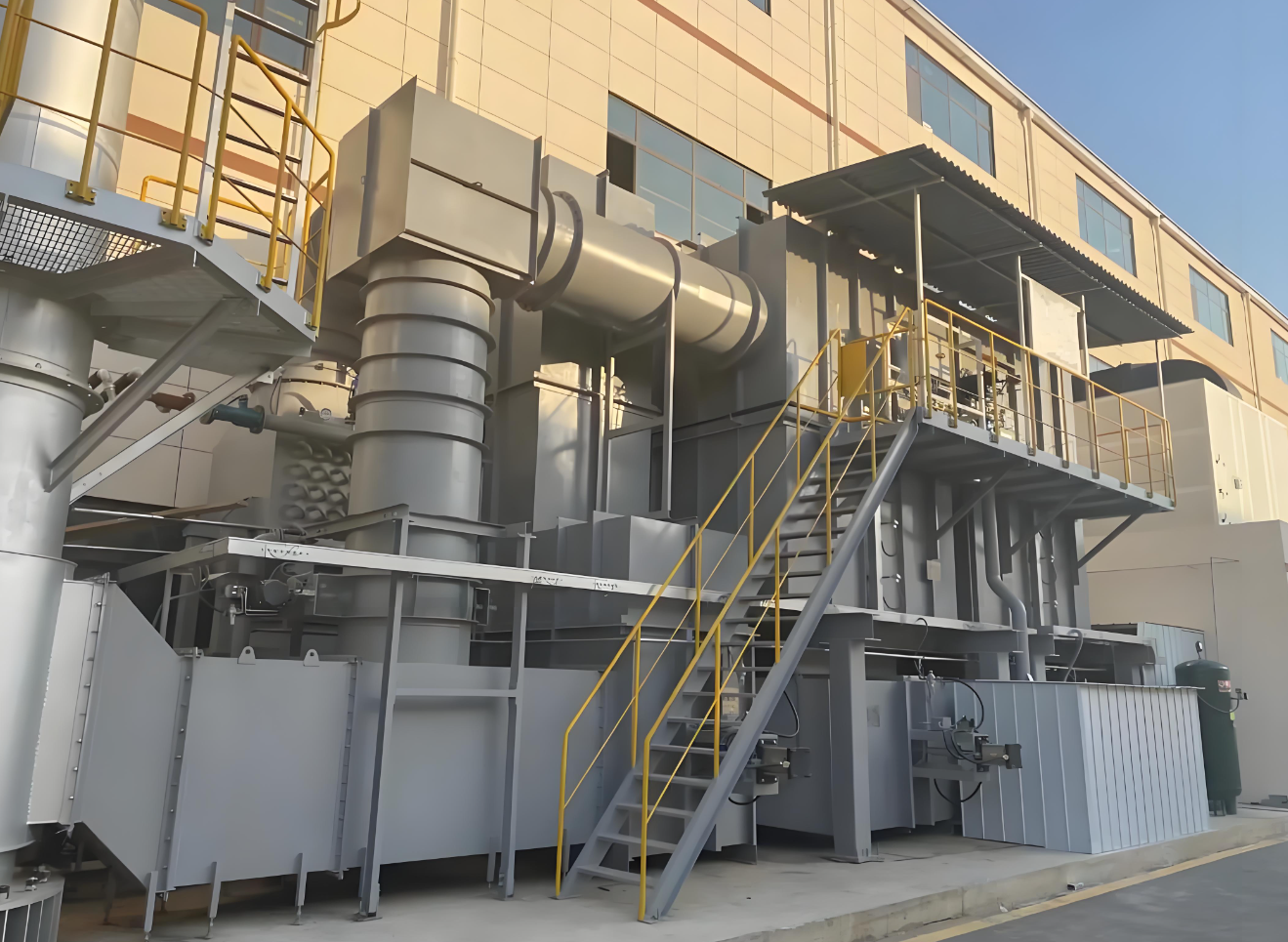Industrial exhaust treatment equipment showing duct connections and service access